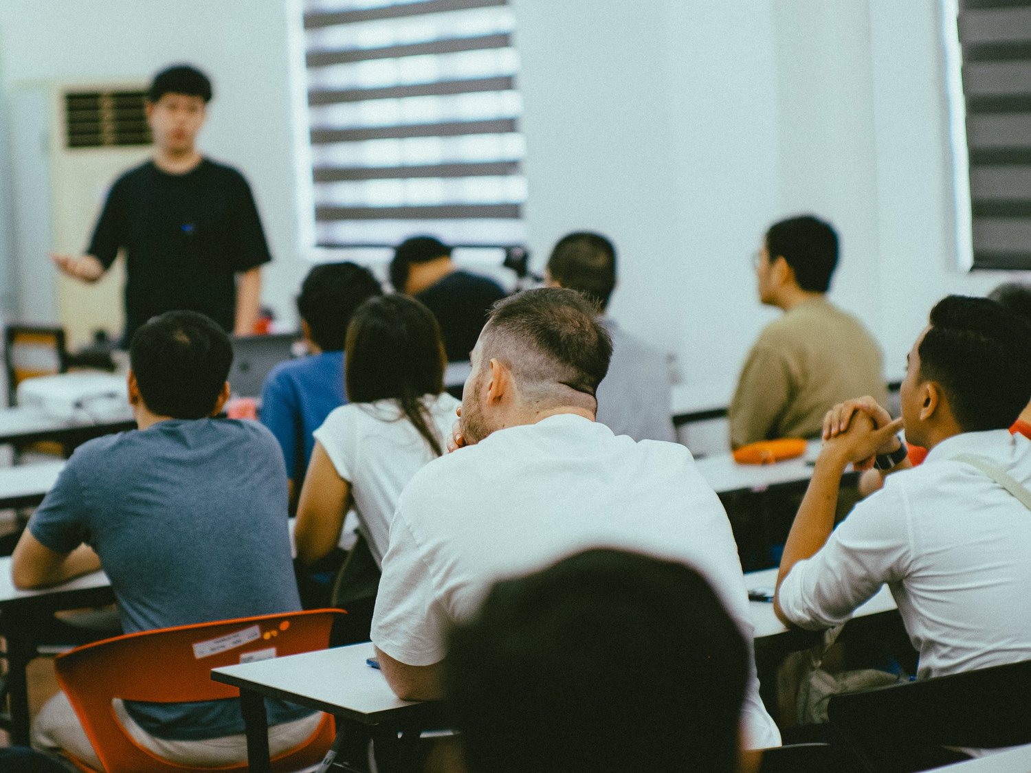 Attendees listening during a Decritech educational workshop